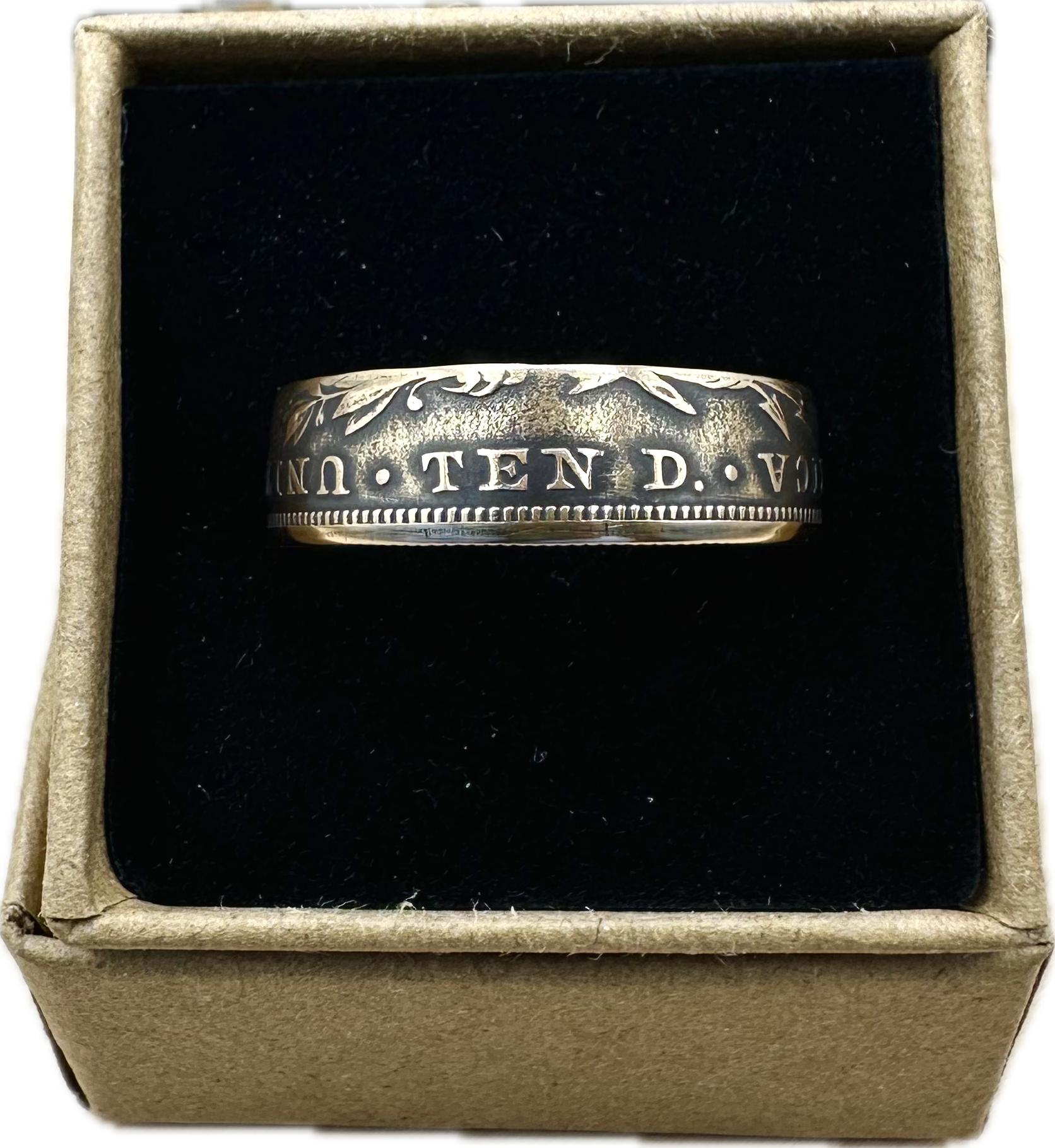 22k U.S. Gold Eagle $10 Coin Ring in a brown kraft box on a black velvet background. - Mountainstruck Coin Jewelry