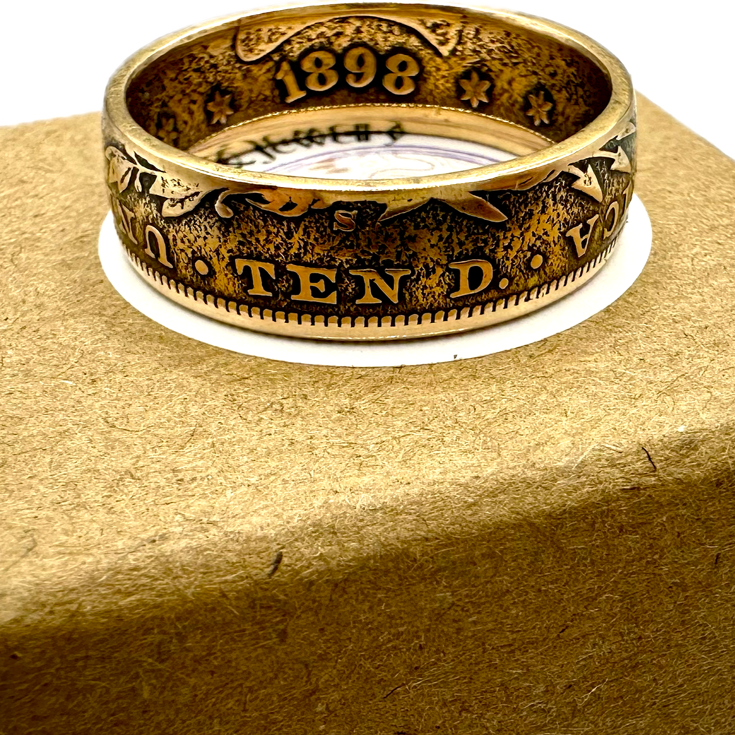 22k U.S. Gold Eagle $10 Coin Ring on a brown kraft box. - Mountainstruck Coin Jewelry