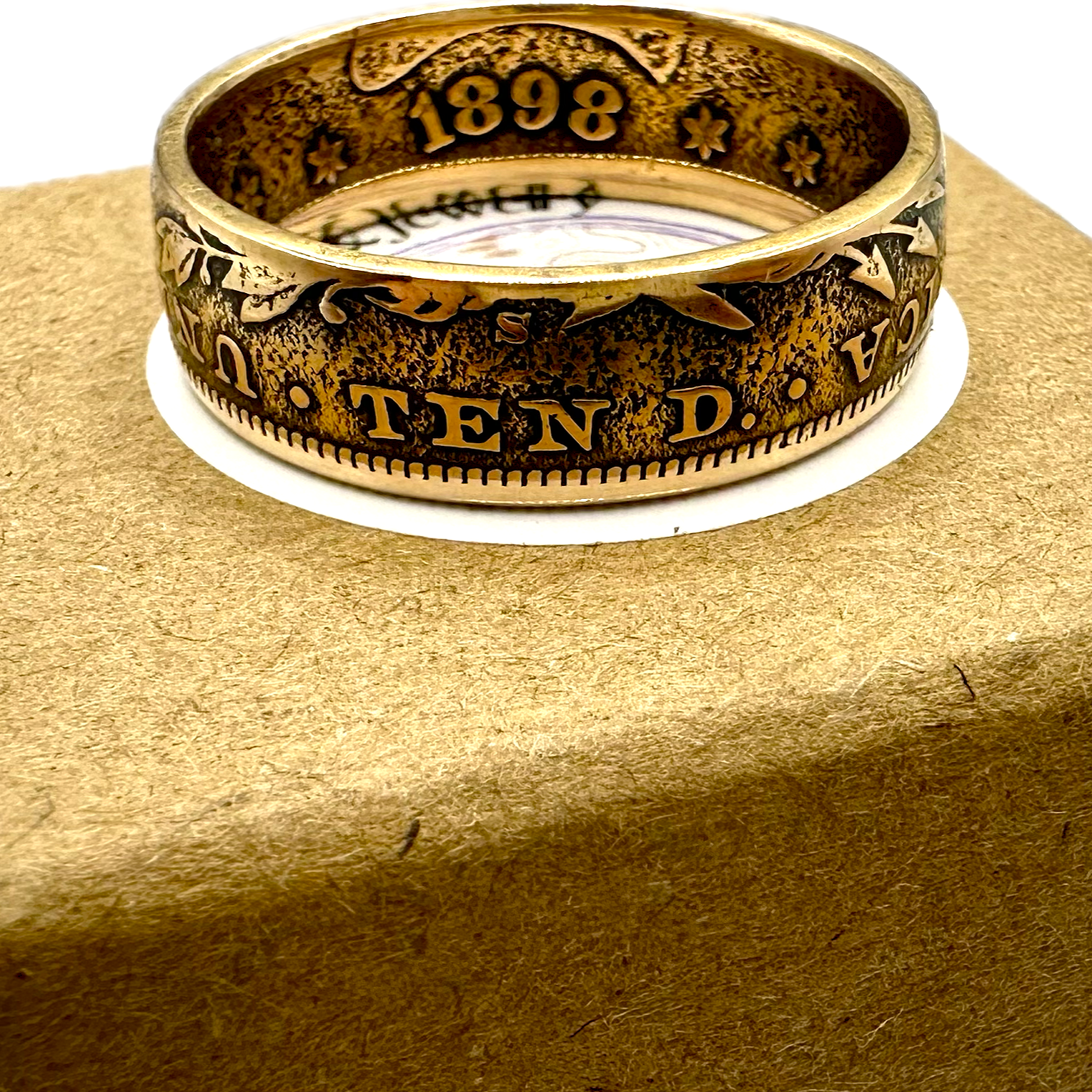 22k U.S. Gold Eagle $10 Coin Ring on a brown kraft box. - Mountainstruck Coin Jewelry