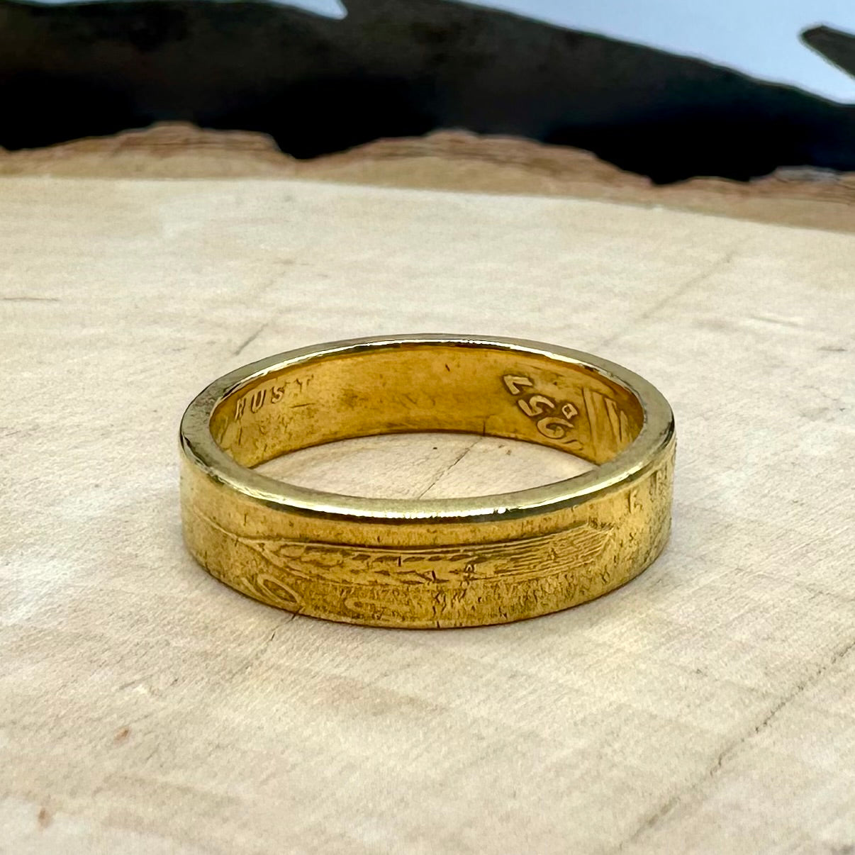 U.S. Wheat Penny Coin Ring on a light wood round. - Mountainstruck Coin Jewelry