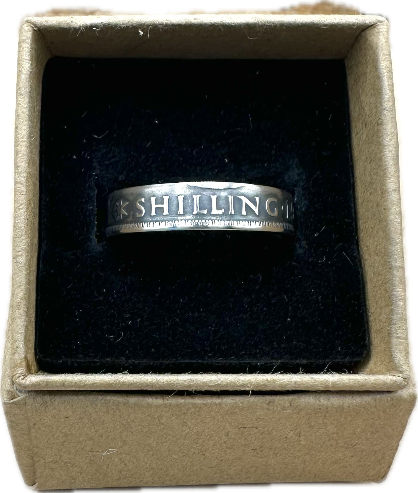 Australia Shilling Silver Coin Ring in a brown kraft box on a black velvet background. - Mountainstruck Coin Jewelry
