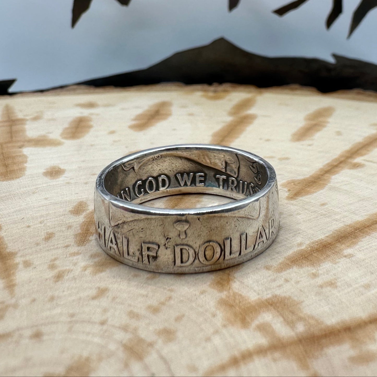 Ben Franklin Half Dollar Silver Coin Ring on a wood background. - Mountainstruck Coin Jewelry