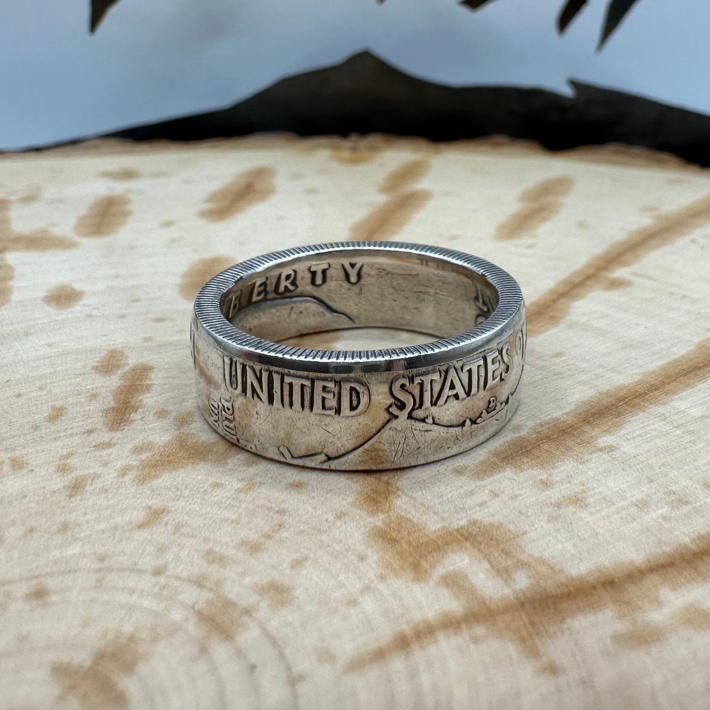 Ben Franklin Half Dollar Silver Coin Ring on a wood background. - Mountainstruck Coin Jewelry