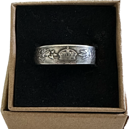 Canada 25 Cents Maple Leaf Silver Coin Ring in a brown kraft box on a black velvet background. - Mountainstruck Coin Jewelry