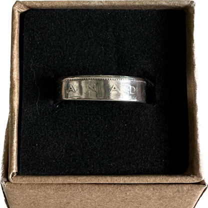 Canada 25 Cents Silver Coin Ring in a brown kraft box on a black velvet background. - Mountainstruck Coin Jewelry