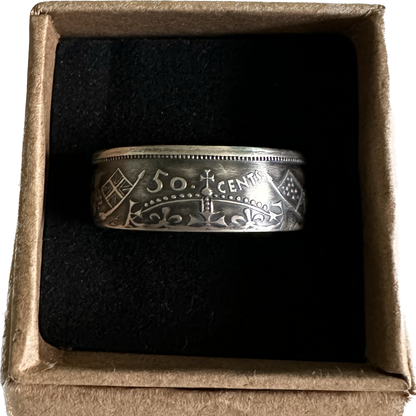 Canada 50 Cents Silver Coin Ring (Lion + Unicorn) in a brown kraft box on a black velvet background. - Mountainstruck Coin Jewelry