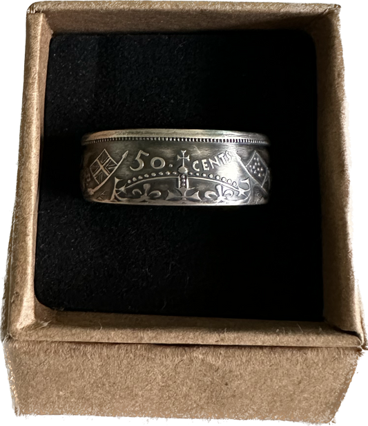 Canada 50 Cents Silver Coin Ring (Lion + Unicorn) in a brown kraft box on a black velvet background. - Mountainstruck Coin Jewelry