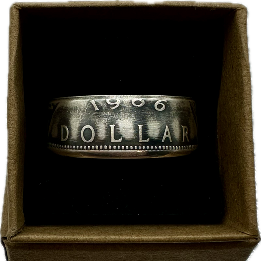 Canada Dollar Silver Coin Ring in a brown kraft box on a black velvet background. - Mountainstruck Coin Jewelry