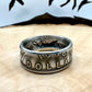 Canada Dollar Silver Coin Ring on a light wood round with a metal mountain background. - Mountainstruck Coin Jewelry