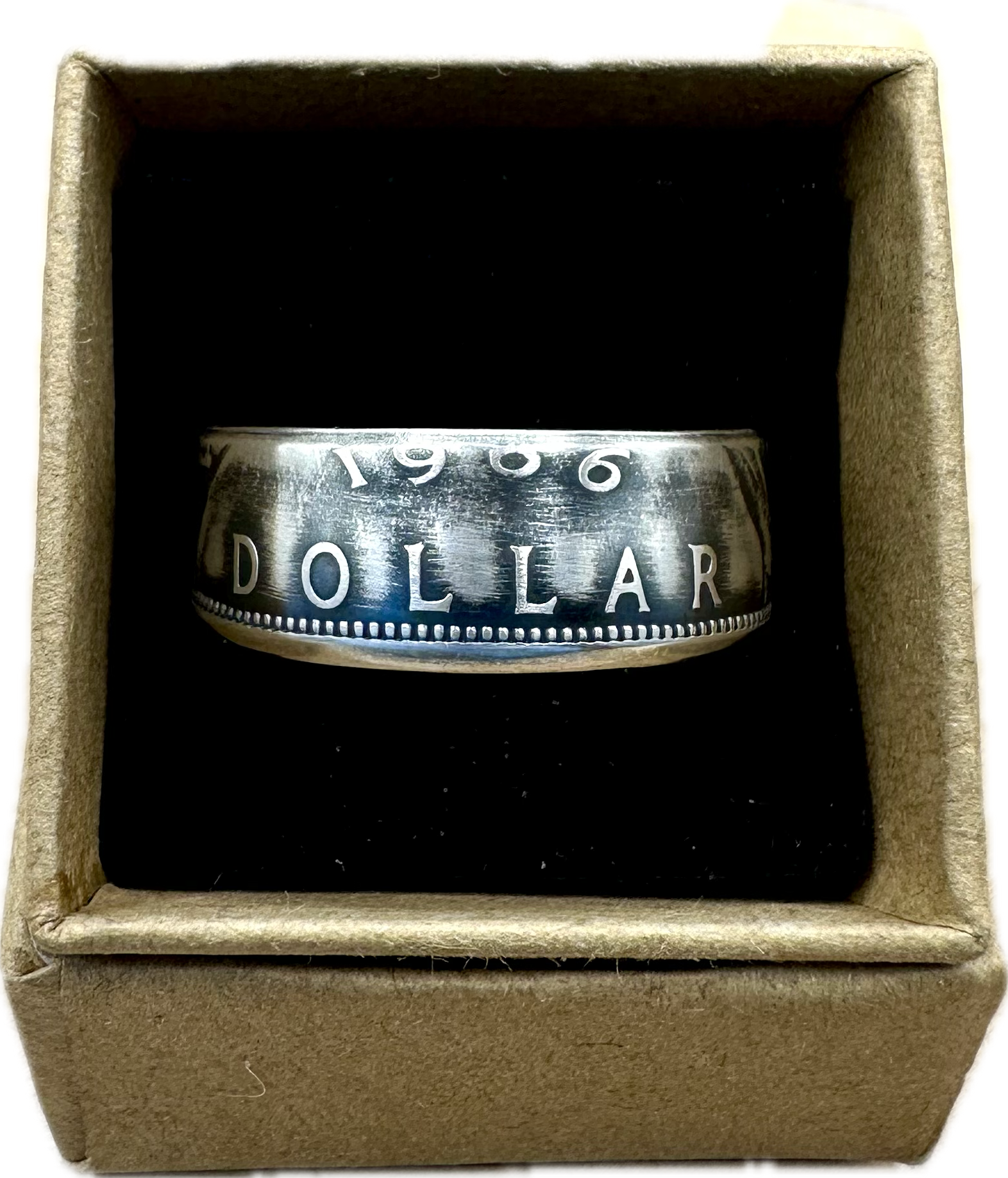 Canada Dollar Silver Coin Ring in a brown kraft box on a black velvet background. - Mountainstruck Coin Jewelry
