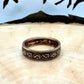 Canada Large Cent Leaf Coin Ring on a light wood round with a mountain outline background. - Mountainstruck Coin Jewelry