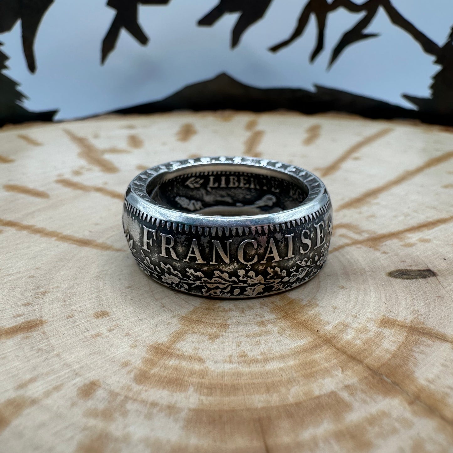 France Silver 10 Francs Coin Ring on a wood background. - Mountainstruck Coin Jewelry