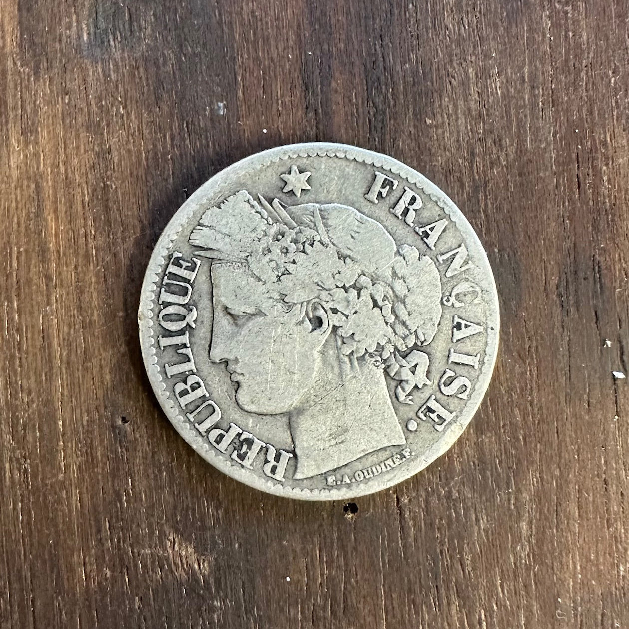 France 2 Franc Silver Coin front on a dark wood background. - Mountainstruck Coin Jewelry