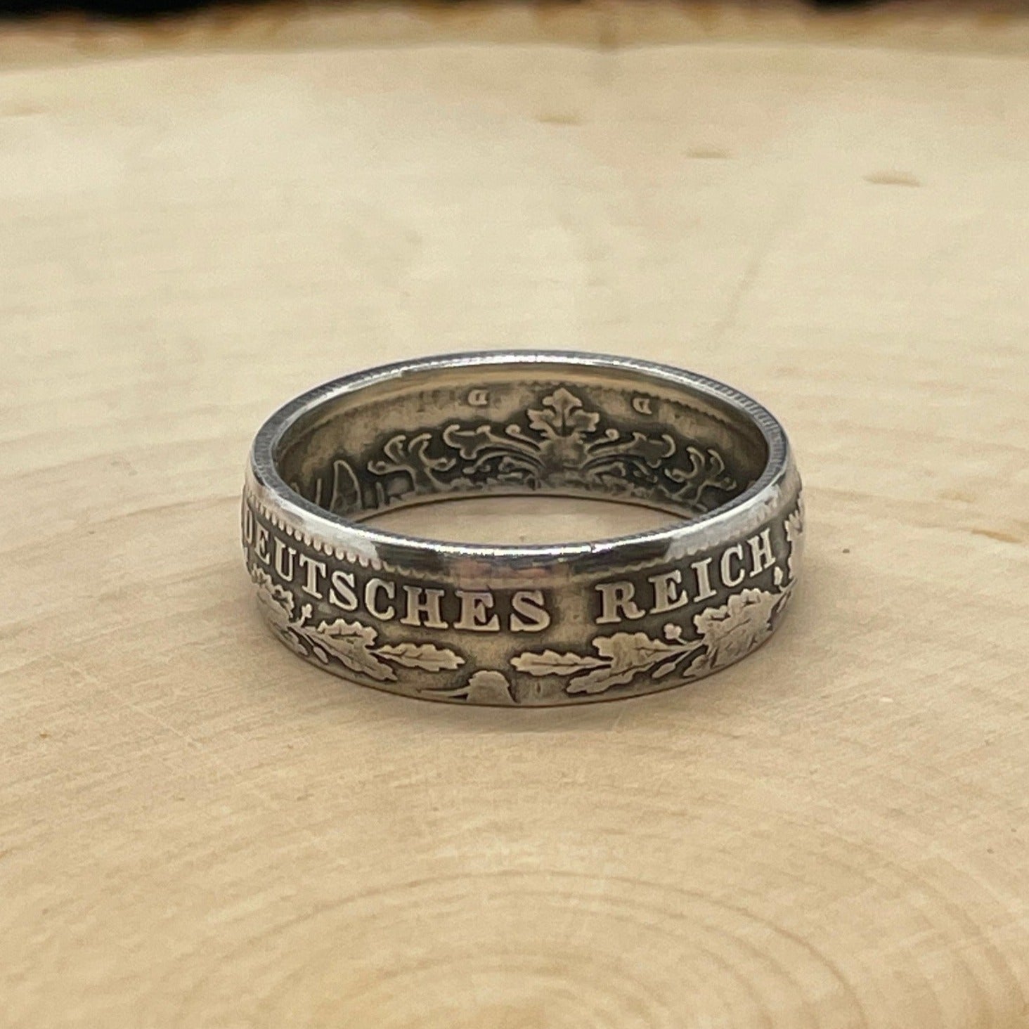 Germany 1 Mark Silver Coin Ring on a light wood round. - Mountainstruck Coin Jewelry