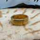 Gold Plated U.S. Presidential Dollar Coin Ring on a wood background. - Mountainstruck Coin Jewelry