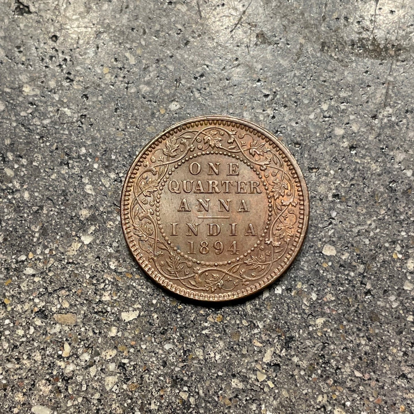India Quarter Anna Coin back on a concrete background. - Mountainstruck Coin Jewelry