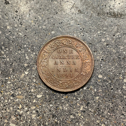 India Quarter Anna Coin back on a concrete background. - Mountainstruck Coin Jewelry