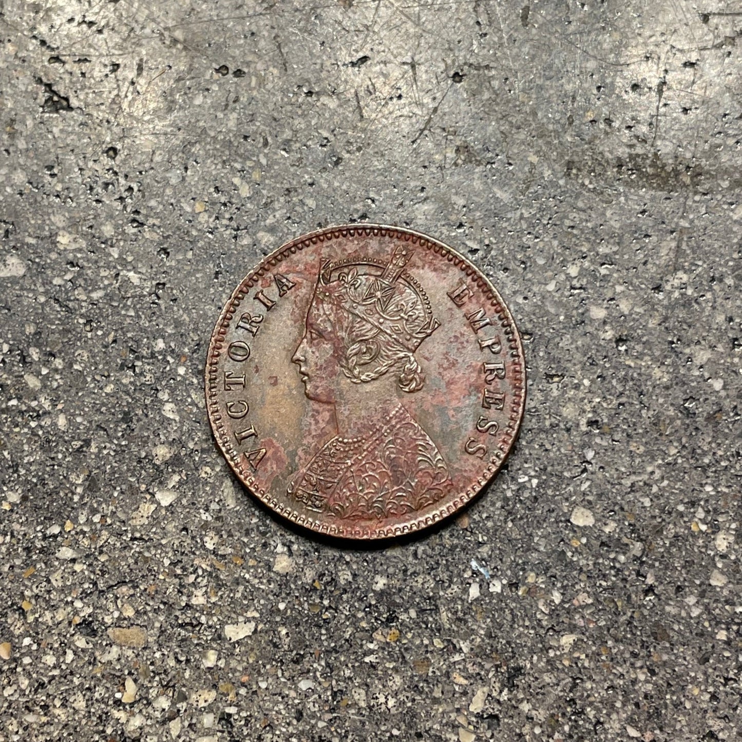 India Quarter Anna Coin front on a concrete background. - Mountainstruck Coin Jewelry