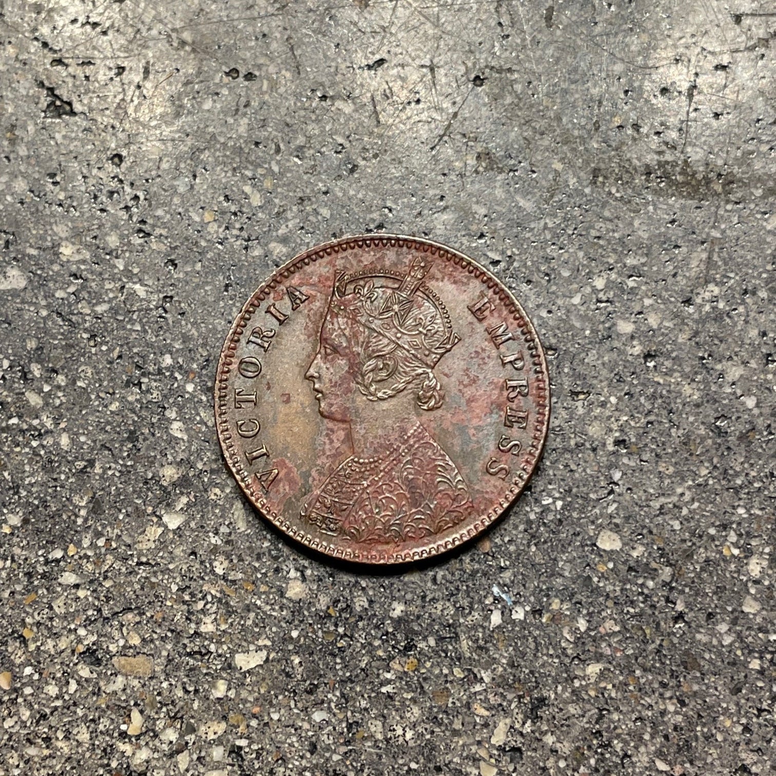 India Quarter Anna Coin front on a concrete background. - Mountainstruck Coin Jewelry