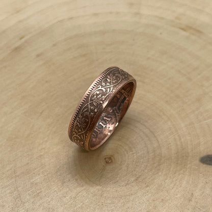 India Quarter Anna Coin Ring on its edge on a light wood round. - Mountainstruck Coin Jewelry