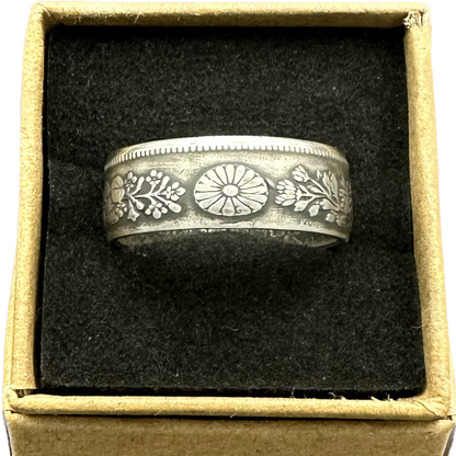 Japan 50 Sen Silver Coin Ring in a brown kraft box on a black velvet background. - Mountainstruck Coin Jewelry