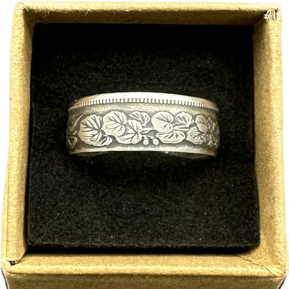 Japan 50 Sen Silver Coin Ring in a brown kraft box on a black velvet background. - Mountainstruck Coin Jewelry
