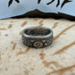 Japan 50 Sen Silver Coin Ring on a wood background. - Mountainstruck Coin Jewelry