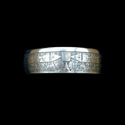 Mexico Aztec Calendar 1/4 oz Silver Round Ring on a black velvet background. 
- Mountainstruck Coin Jewelry
