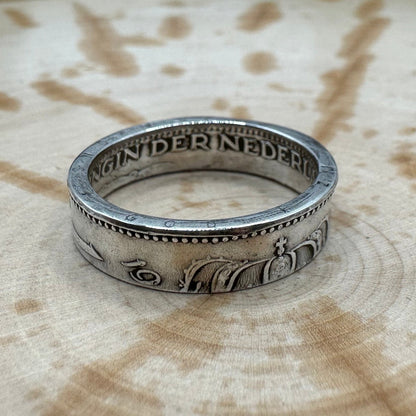 Netherlands 1 Gulden Silver Coin Ring  on a wood background. - Mountainstruck Coin Jewelry