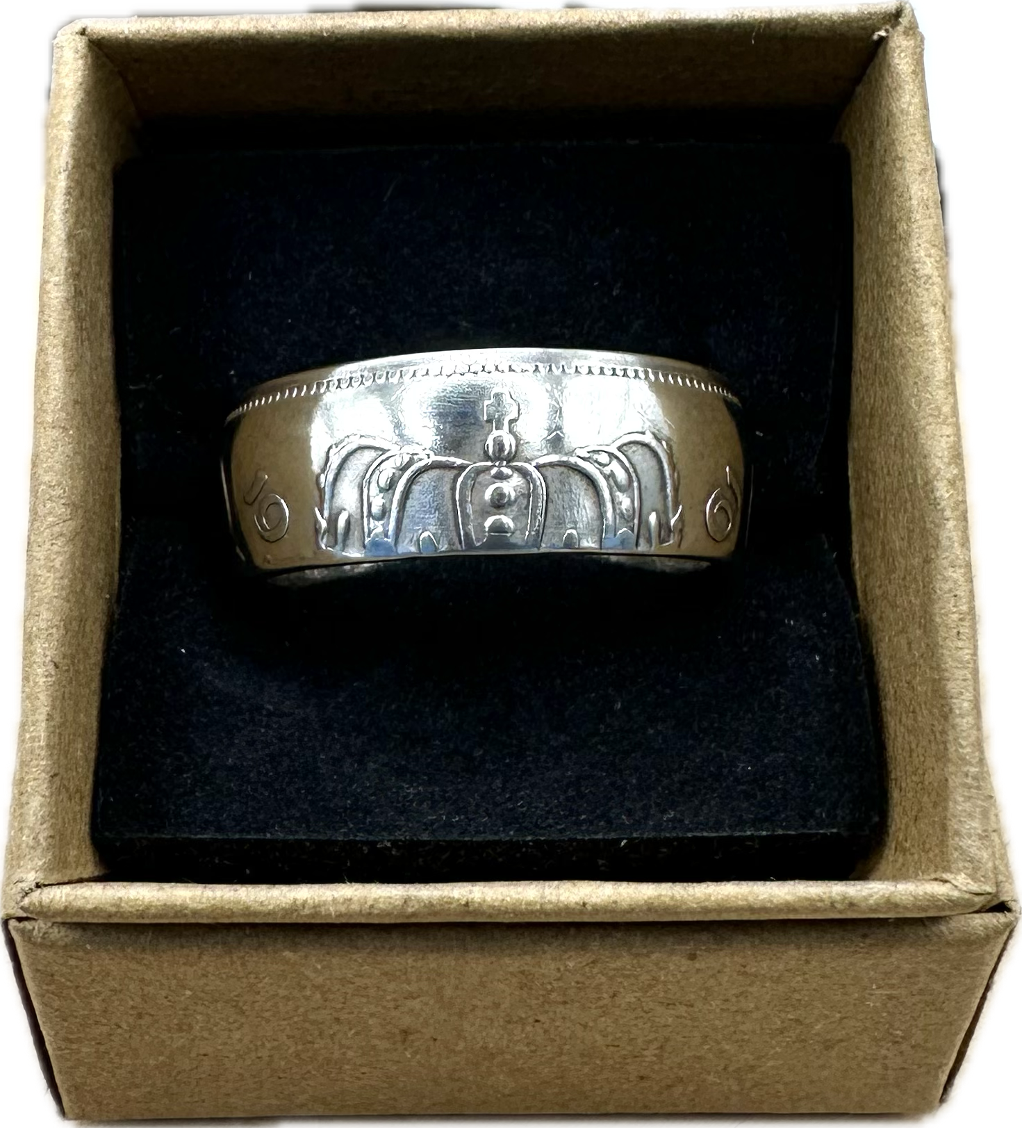 Netherlands 2.5 Gulden Silver Coin Ring in a brown kraft box on black velvet background. - Mountainstruck Coin Jewelry