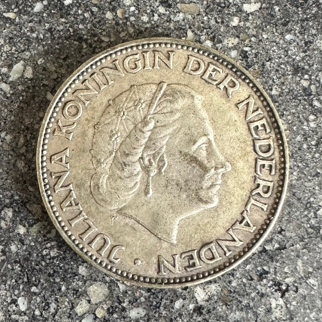Netherlands 2.5 Gulden Silver Coin front on a concrete surface. - Mountainstruck Coin Jewelry