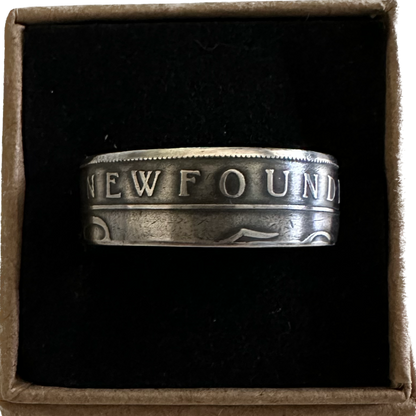 Newfoundland 50 Cents Silver Coin Ring in a brown kraft box on a black velvet background. - Mountainstruck Coin Jewelry