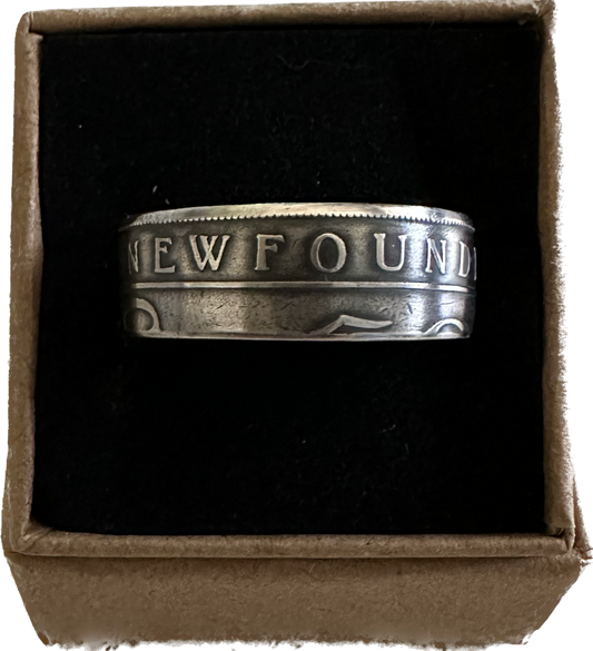 Newfoundland 50 Cents Silver Coin Ring in a brown kraft box on a black velvet background. - Mountainstruck Coin Jewelry