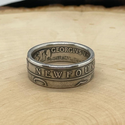 Newfoundland 50 Cents Silver Coin Ring on a light wood round. - Mountainstruck Coin Jewelry