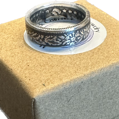 Swiss 1 Franc Silver Coin Ring on a brown kraft box. - Mountainstruck Coin Jewelry