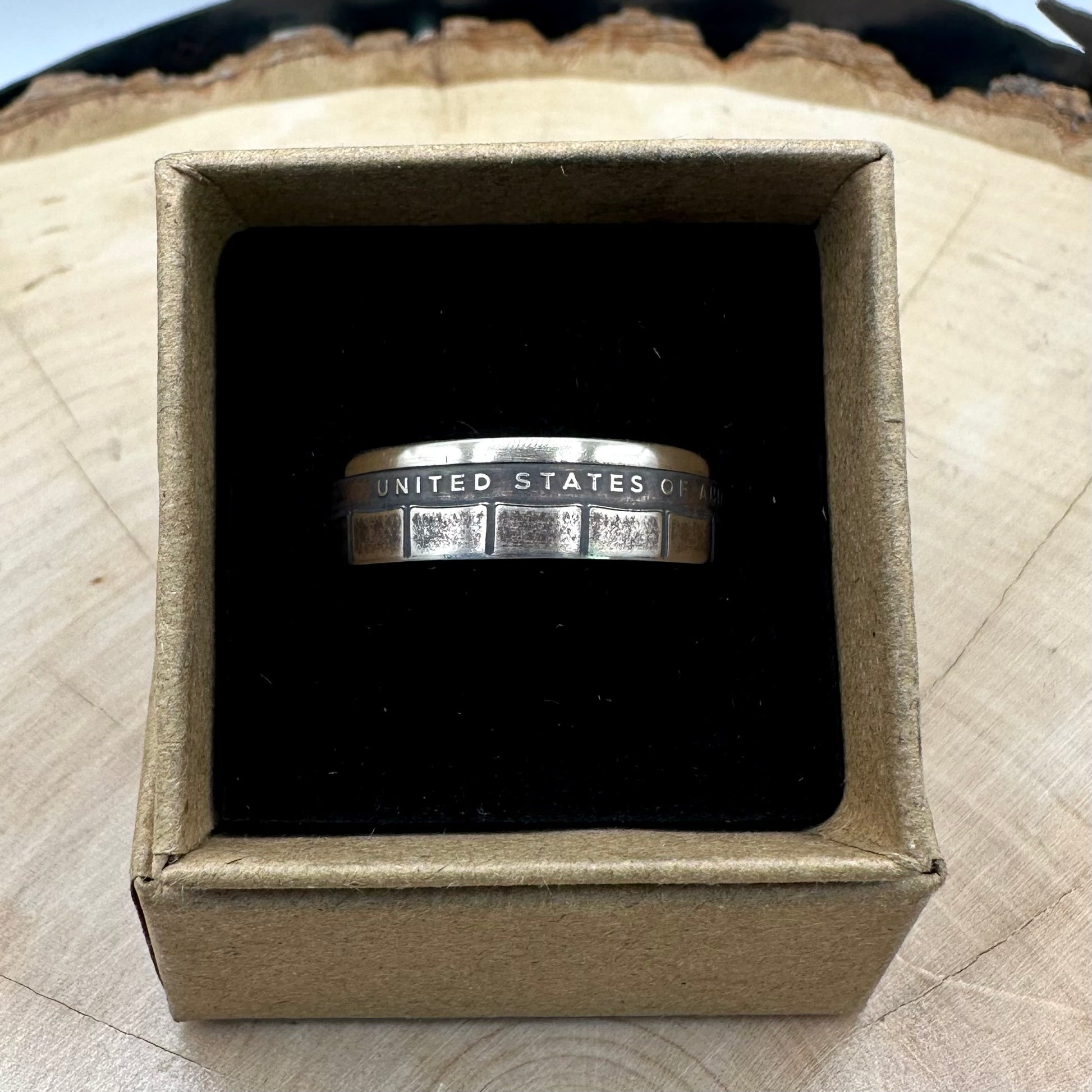 U.S. 2026 "CRAY-1 Supercomputer" 1 Dollar Coin Ring on a black velvet background in a brown kraft box on a wood round. - Mountainstruck Coin Jewelry