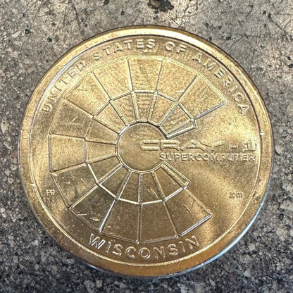 U.S. 2026 "CRAY-1 Supercomputer" 1 Dollar Coin on a concrete background. - Mountainstruck Coin Jewelry