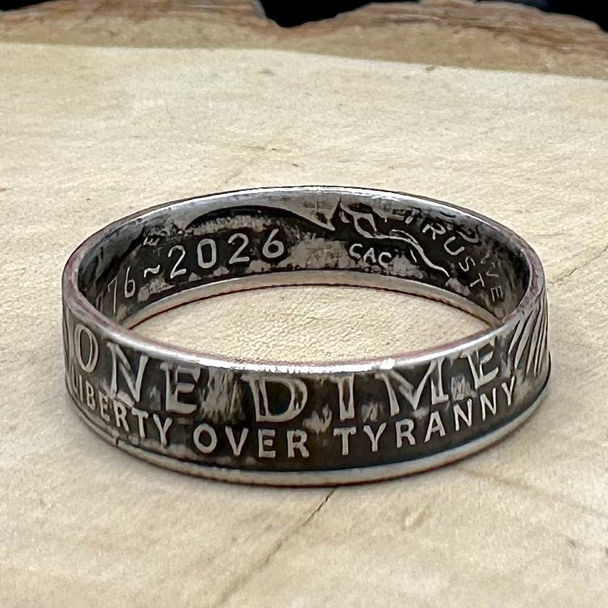 U.S. 2026 "Liberty Over Tyranny" Dime Coin Ring on a wood round. -Mountainstruck Coin Jewelry