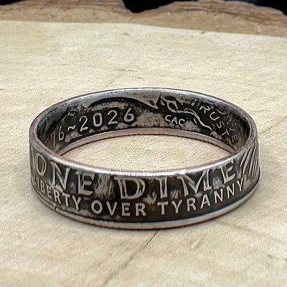 U.S. 2026 "Liberty Over Tyranny" Dime Coin Ring on a wood round. -Mountainstruck Coin Jewelry