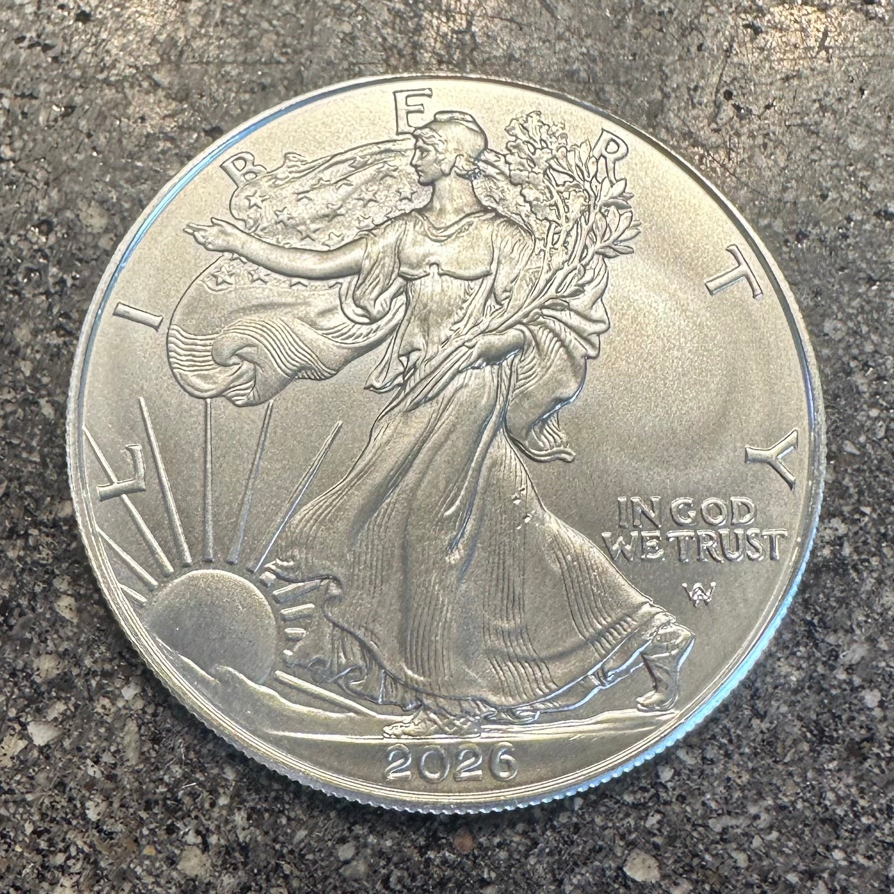 U.S. 2026 1oz 999 Silver Eagle $1 Coin on a concrete background. - Mountainstruck Coin Jewelry