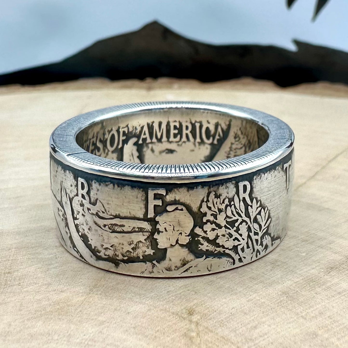 U.S. 2026 1oz 999 Silver Eagle $1 Coin Ring on a wood round. - Mountainstruck Coin Jewelry