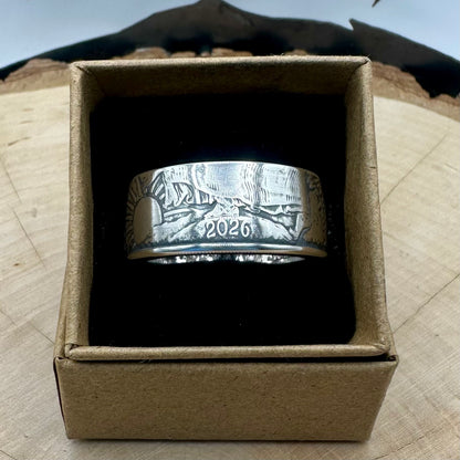 U.S. 2026 1oz 999 Silver Eagle $1 Coin Ring on a black velvet background in a brown kraft box on a wood round. - Mountainstruck Coin Jewelry