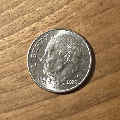 U.S. Dime Coin front on a wood background. - Mountainstruck Coin Jewelry