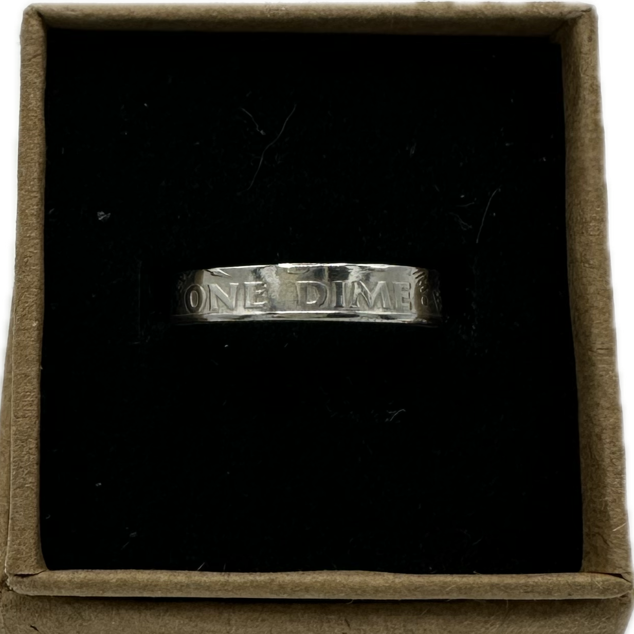U.S. Dime Silver Coin Ring shine in a brown craft box on a black velvet background. - Mountainstruck Coin Jewelry