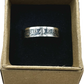 U.S. Standing Liberty Quarter Silver Coin Ring in a brown kraft box on a black velvet background. - Mountainstruck Coin Jewelry