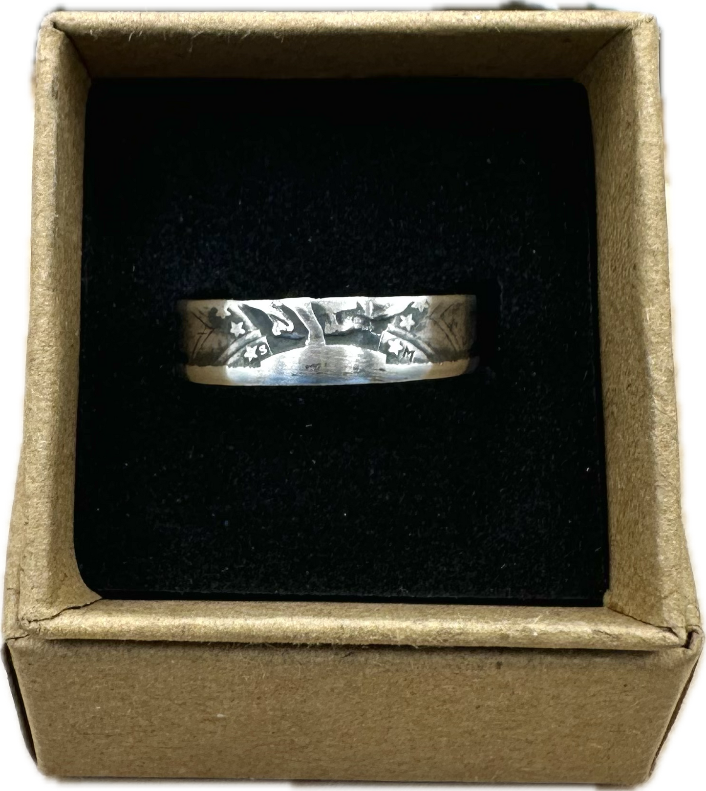 U.S. Standing Liberty Quarter Silver Coin Ring in a brown kraft box on a black velvet background. - Mountainstruck Coin Jewelry