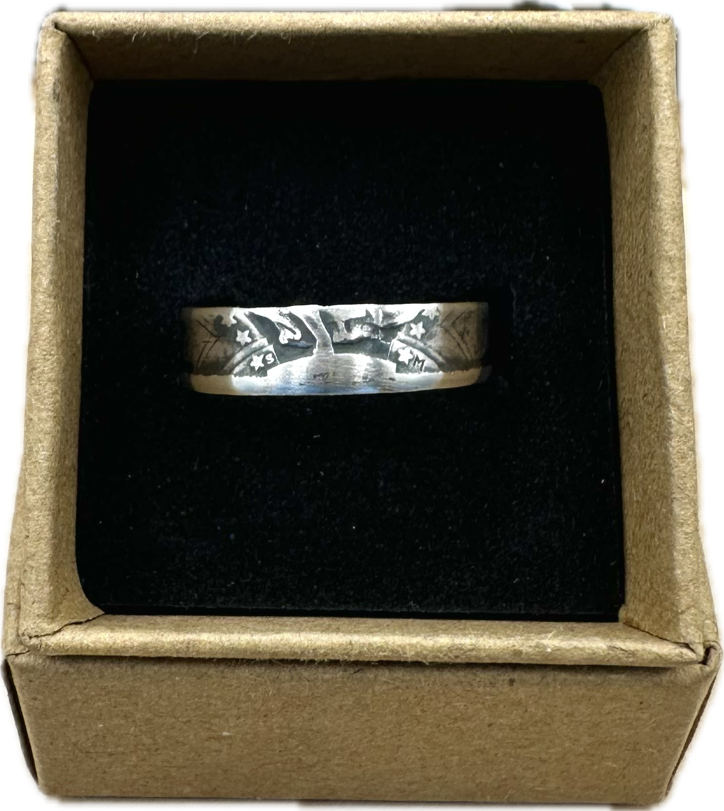 U.S. Standing Liberty Quarter Silver Coin Ring in a brown kraft box on a black velvet background. - Mountainstruck Coin Jewelry
