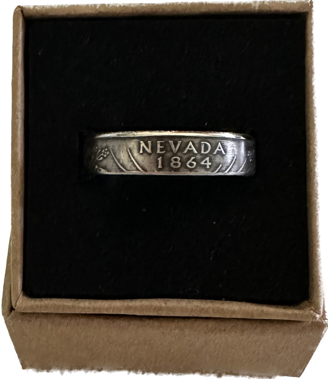 U.S. State Quarter Silver Coin Ring
featuring Nevada in a brown kraft box on a black velvet background. - Mountainstruck Coin Jewelry