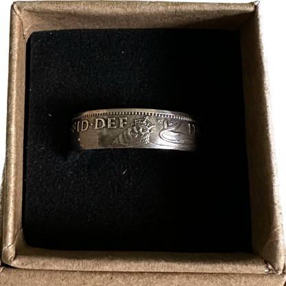 UK One Shilling Silver Coin Ring (shine) in a brown kraft box on a black velvet background. - Mountainstruck Coin Jewelry