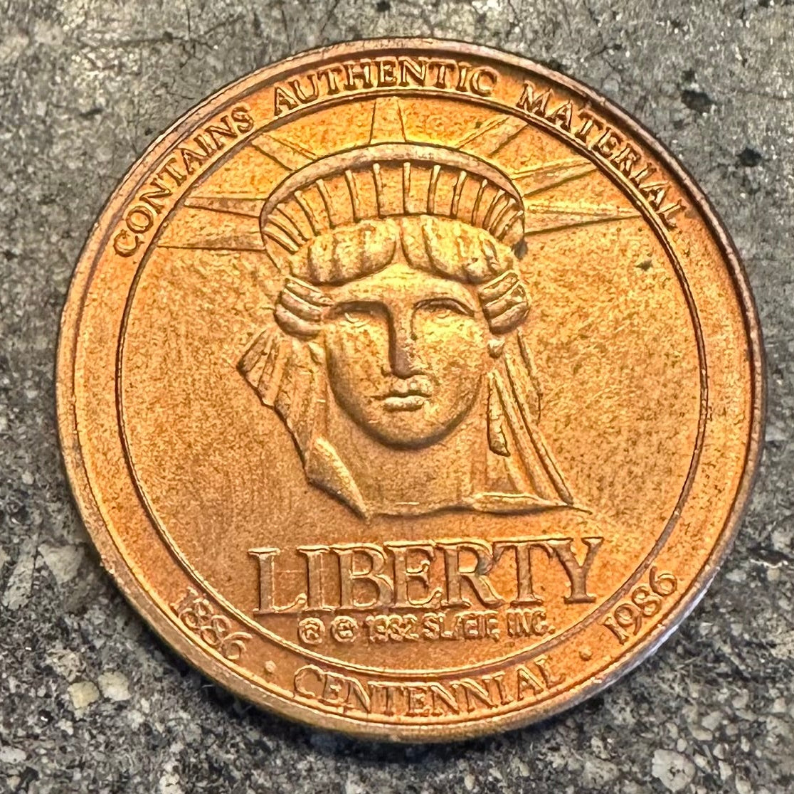 U.S. Authentic Copper Statue of Liberty Token front on a dark grey background. - Mountainstruck Coin Jewelry